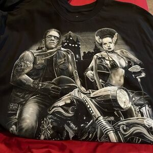 Frankenstein and bride on bikes
